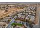 Aerial view of a residential neighborhood with well-maintained homes and desert landscaping at 3864 W Fairway Dr, Eloy, AZ 85131