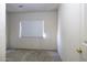 Neutral bedroom with carpeted floor and a window with white blinds at 3864 W Fairway Dr, Eloy, AZ 85131