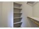 Organized walk-in closet featuring white shelving and wooden rods at 3864 W Fairway Dr, Eloy, AZ 85131