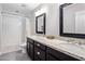 Bathroom featuring dual sinks, granite counters, and a shower-tub combo at 4225 N 42Nd St, Phoenix, AZ 85018