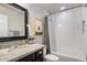 Bright bathroom with white subway tile, granite counters, and stylish black-framed mirror at 4225 N 42Nd St, Phoenix, AZ 85018