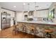 Spacious kitchen with white cabinets, stainless steel appliances, and a stone-accented center island at 4225 N 42Nd St, Phoenix, AZ 85018