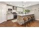 Well-equipped kitchen with stainless steel appliances, stone-accented island, and bar stool seating at 4225 N 42Nd St, Phoenix, AZ 85018