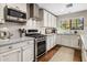 Bright kitchen with stainless steel oven, modern backsplash, and natural light at 4225 N 42Nd St, Phoenix, AZ 85018