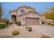 Charming two-story home with a two car garage, manicured front yard with desert landscaping, and a neutral color palette at 4228 E Desert Sky Ct, Cave Creek, AZ 85331