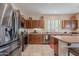 Modern kitchen featuring stainless steel appliances, granite countertops, and ample cabinet space at 4228 E Desert Sky Ct, Cave Creek, AZ 85331