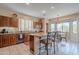 Modern eat-in kitchen with stainless steel appliances, granite countertops, and a breakfast bar with seating at 4228 E Desert Sky Ct, Cave Creek, AZ 85331