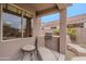 An outdoor kitchen area with a built-in grill and a lounge area at 4228 E Desert Sky Ct, Cave Creek, AZ 85331