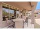 Inviting covered patio with outdoor dining area, offering serene views of the pool and desert landscape at 4228 E Desert Sky Ct, Cave Creek, AZ 85331