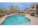 Inviting backyard pool with a tanning deck and a lush landscaped perimeter at 4228 E Desert Sky Ct, Cave Creek, AZ 85331