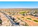 Wide shot of the community, golf course, and surrounding arid landscape at 42829 W Oakland Dr, Maricopa, AZ 85138