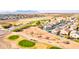 Panoramic aerial view of a golf community featuring lush green fairways and beautiful single Gathering homes at 42829 W Oakland Dr, Maricopa, AZ 85138