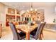 Elegant dining area with a marble-topped table, comfortable seating, and stylish lighting at 42829 W Oakland Dr, Maricopa, AZ 85138