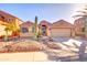 Charming single-story home with a well-manicured rock yard, desert landscaping, and a two-car garage at 42829 W Oakland Dr, Maricopa, AZ 85138