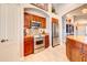 Stylish kitchen featuring granite countertops, stainless steel appliances, and abundant cabinet space at 42829 W Oakland Dr, Maricopa, AZ 85138