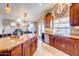 Open kitchen with granite countertops, stainless steel appliances, and a view of the dining area at 42829 W Oakland Dr, Maricopa, AZ 85138