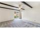 Bright bedroom with a ceiling fan and sliding glass doors leading to the backyard at 4312 W Paradise Dr, Glendale, AZ 85304