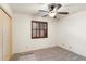 Bedroom featuring a ceiling fan, carpeted floors, and window with wood shutters at 4312 W Paradise Dr, Glendale, AZ 85304