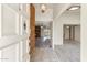 Inviting foyer with tiled entry, offering a view of the living spaces and fireplace at 4312 W Paradise Dr, Glendale, AZ 85304