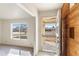 Bright foyer featuring tile flooring, front door, and view of the living room at 4312 W Paradise Dr, Glendale, AZ 85304