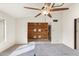 Spacious living room features a ceiling fan and a view of the dining area at 4312 W Paradise Dr, Glendale, AZ 85304