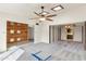 Open living room design with unique wood accent wall and natural light from skylights at 4312 W Paradise Dr, Glendale, AZ 85304