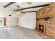 Inviting living room showcases a cozy fireplace and a stylish ceiling fan at 4312 W Paradise Dr, Glendale, AZ 85304