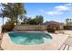 Backyard featuring a private pool with a spacious patio area and lush landscaping at 4312 W Paradise Dr, Glendale, AZ 85304