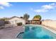 Exterior view of pool and gazebo in backyard with lush landscaping at 4312 W Paradise Dr, Glendale, AZ 85304