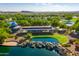 Aerial view of the community railroad, surrounded by lush trees and serene ponds at 44025 N 44Th Ln, New River, AZ 85087