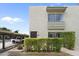 Exterior view of the condo featuring carport parking, desert landscaping, and a private entrance at 4610 N 68Th St # 416, Scottsdale, AZ 85251