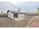 View of backyard featuring a covered patio, desert landscaping, and a privacy fence at 4814 E Pearce Rd, Phoenix, AZ 85044