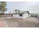 Backyard featuring desert landscaping, a patio, and a view of the home's exterior at 4814 E Pearce Rd, Phoenix, AZ 85044