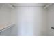 A large walk-in closet with shelving and a hanging rod for ample storage at 4814 E Pearce Rd, Phoenix, AZ 85044