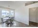 Dining area featuring a modern chandelier and a view to the front yard at 4814 E Pearce Rd, Phoenix, AZ 85044