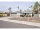 Charming single-story home featuring desert landscaping and a two-car attached garage at 4814 E Pearce Rd, Phoenix, AZ 85044