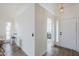 Bright foyer with tile floors, white walls, and a view to the breakfast nook at 4814 E Pearce Rd, Phoenix, AZ 85044