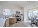 Modern kitchen with white cabinets, stainless steel appliances, and an adjacent dining area at 4814 E Pearce Rd, Phoenix, AZ 85044