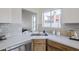 Close-up of kitchen counter showcasing quartz countertops and stainless steel appliances at 4814 E Pearce Rd, Phoenix, AZ 85044