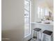 Stylish kitchen with breakfast bar seating and natural light at 4814 E Pearce Rd, Phoenix, AZ 85044