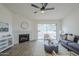 Bright living room featuring a fireplace and sliding glass door to the patio at 4814 E Pearce Rd, Phoenix, AZ 85044