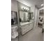 Bathroom featuring white cabinetry and neutral walls with view of a bedroom at 5250 E Deer Valley Dr # 344, Phoenix, AZ 85054