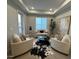 Bright sitting room featuring a decorative rug, comfortable armchairs, and a view of the outdoor balcony at 5250 E Deer Valley Dr # 344, Phoenix, AZ 85054