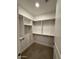 Compact walk-in closet with carpeted floor, white walls and simple shelving at 5250 E Deer Valley Dr # 344, Phoenix, AZ 85054