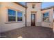 Front exterior of a home showcasing a stone walkway and a stained wood door at 551 E Citrus Hollow Way, Queen Creek, AZ 85140