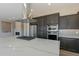 Kitchen island featuring a white countertop, and stainless steel appliances at 551 E Citrus Hollow Way, Queen Creek, AZ 85140