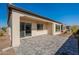 Outdoor patio featuring stylish gray brickwork and a covered area, great for entertaining and relaxation at 551 E Citrus Hollow Way, Queen Creek, AZ 85140