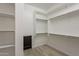 Well-organized walk-in closet with white shelving and drawers for efficient storage and organization solutions at 551 E Citrus Hollow Way, Queen Creek, AZ 85140