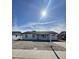 Charming single-story home with a well-maintained gravel front yard, covered porch, and clear blue skies above at 5729 N 64Th Dr, Glendale, AZ 85301