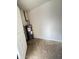 Small, unfinished utility room featuring a water heater and basic concrete flooring for essential systems at 5729 N 64Th Dr, Glendale, AZ 85301